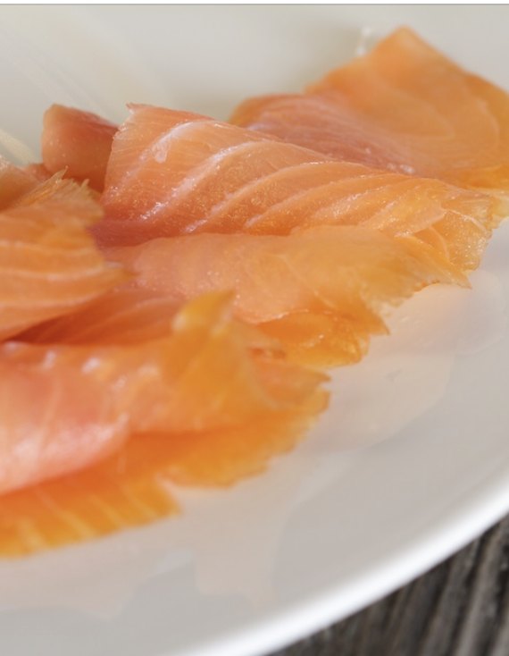Sliced cold smoked salmon on a plate